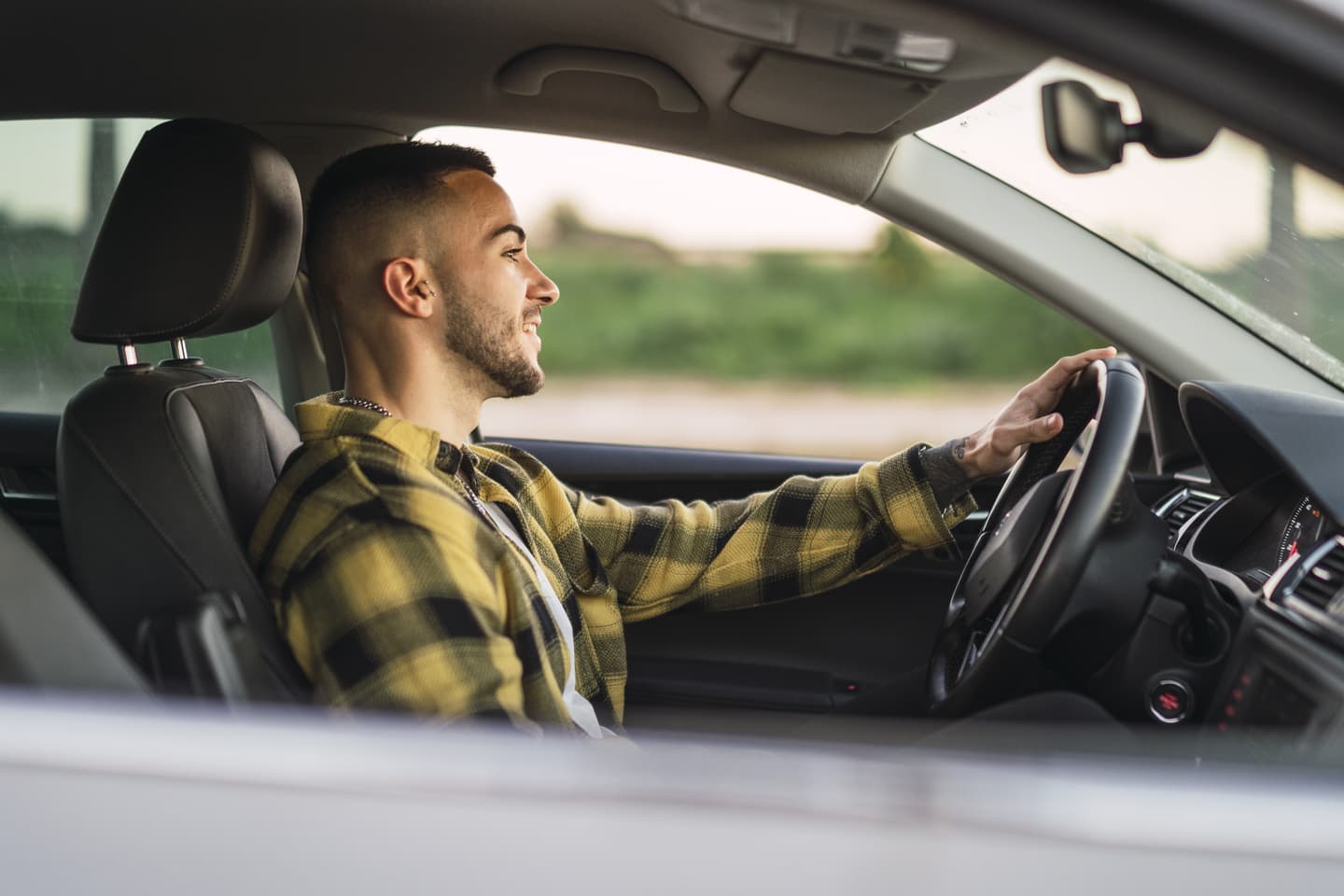 Driver operating a vehicle to illustrate GPS-based fleet management