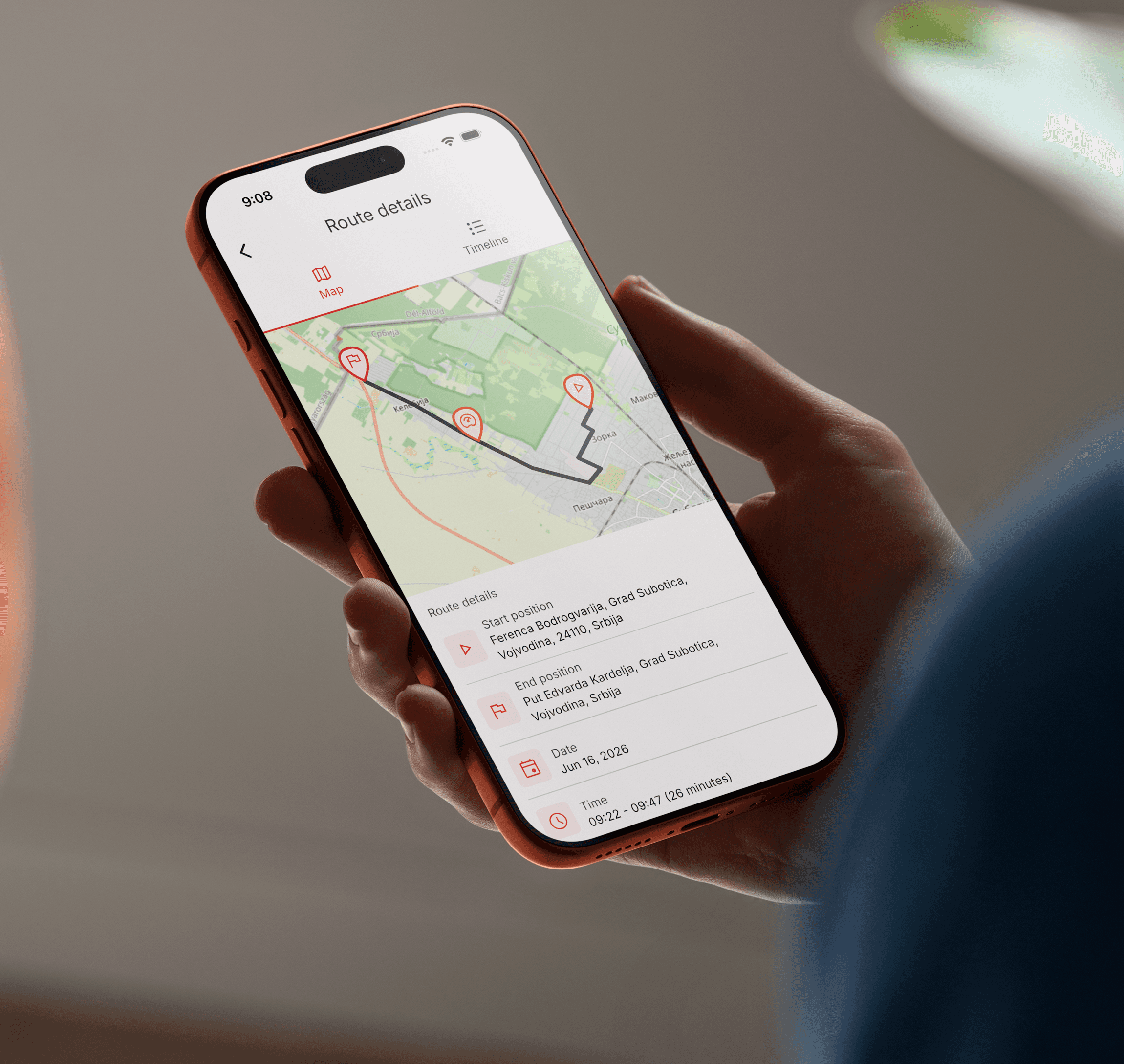 Driver using a mobile app to view route and driving information.